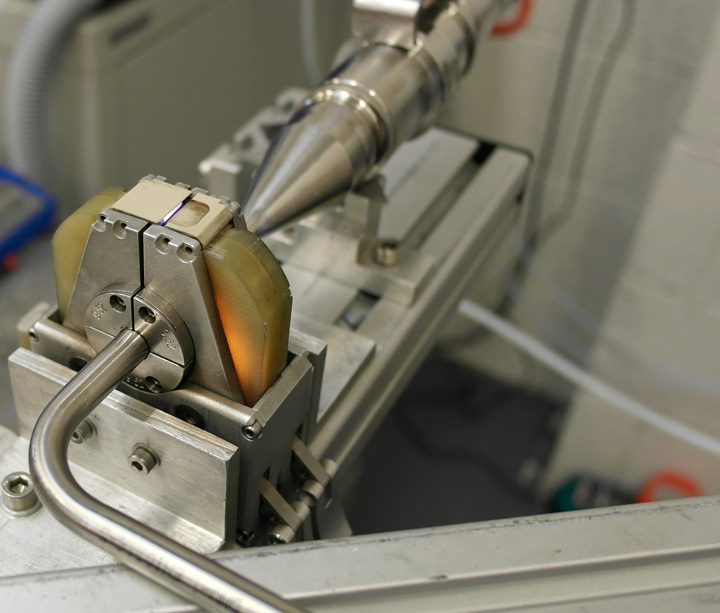 Orbital weld head welding a bent stainless steel tube