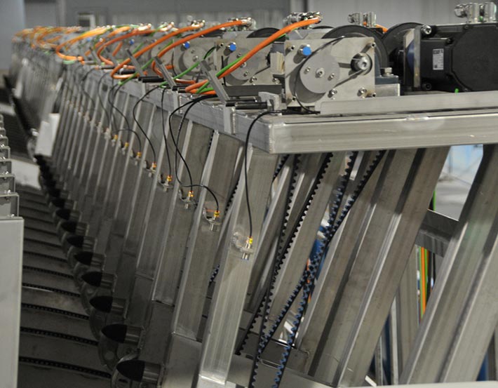 Row of stainless steel framed machine modules with drives